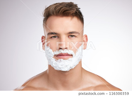 Man, portrait and shaving foam on face in studio, grooming and facial care for beard hair removal with product. Serious, skincare and dermatology or cosmetology, cleaning hygiene and white background Man, portrait and shaving foam on face in studio, grooming and facial care for beard hair removal with product. Serious, skincare and dermatology or cosmetology, cleaning hygiene and white background 116300359