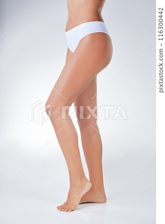 Woman, underwear and legs for hair removal with cosmetics, skincare and epilation in white studio background. Female person, smooth wax or clean shave relaxing for health, wellness and hygiene Woman, underwear and legs for hair removal with cosmetics, skincare and epilation in white studio background. Female person, smooth wax or clean shave relaxing for health, wellness and hygiene 116300442