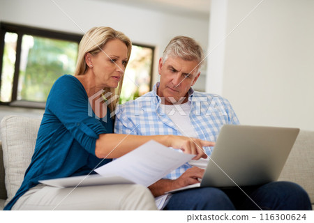 Couple, couch and document with laptop and point, finances or taxes for audit in living room. Paperwork, contract or online for mortgage insurance, investment or man with female person in home lounge Couple, couch and document with laptop and point, finances or taxes for audit in living room. Paperwork, contract or online for mortgage insurance, investment or man with female person in home lounge 116300624