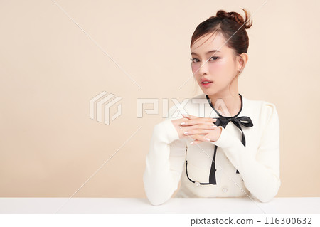 Beautiful young asian woman with clean fresh skin on beige background, Face care, Facial treatment, Cosmetology, beauty and spa, Asian women portrait. 116300632