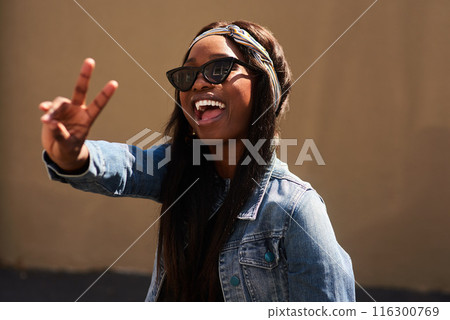 Peace sign, happy and black woman with streetwear with sunglasses, energy and excited in city. Gen z girl, happiness and v hand gesture as influencer for post, status update or expression on sidewalk Peace sign, happy and black woman with streetwear with sunglasses, energy and excited in city. Gen z girl, happiness and v hand gesture as influencer for post, status update or expression on sidewalk 116300769