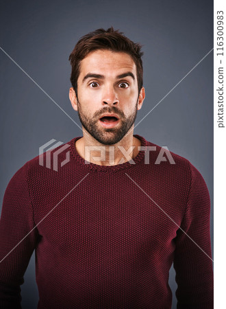 Studio, surprise and man with news, portrait and gossip of discount, wow and rumor in mockup space. Gray background, face and person with shock, secret and fear for phobia and scared with alert Studio, surprise and man with news, portrait and gossip of discount, wow and rumor in mockup space. Gray background, face and person with shock, secret and fear for phobia and scared with alert 116300983
