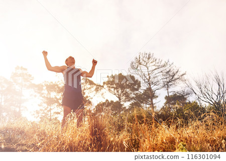 Man, running and achievement with celebration in nature, winning with fitness goals. Male runner, proud and exercise with victory for personal time up mountain, cheering for best speed in marathon 116301094