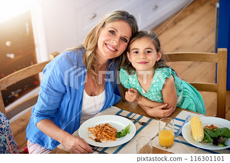 Food, portrait or mom hug daughter in house for mothers day lunch, bonding and eating together. Happy family, support and face of girl with mama at home for pasta brunch, diet or organic nutrition 116301101