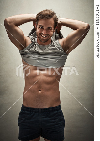 Portrait, man and smile with abs in studio background for healthy body, workout and exercise. Male person, happy and shirtless isolated on backdrop for fitness, confidence and training with six pack Portrait, man and smile with abs in studio background for healthy body, workout and exercise. Male person, happy and shirtless isolated on backdrop for fitness, confidence and training with six pack 116301141