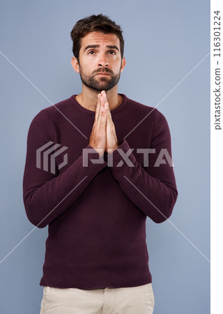 Studio, worship and man pray for faith, praise and asking for help, Jesus Christ and religion of Christianity. Blue background, hands and respect for God, spiritual and holy with belief of Heaven 116301224