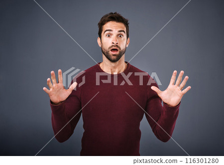 Gray background, shock and portrait of man, studio and wow with hands, mouth and amazed by announcement. Face, employee and person with surprise for bonus, designer and raise in work and Canada 116301280