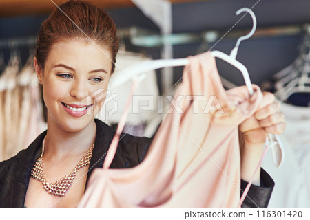Happy, shopping and woman with choice in boutique searching for fashion deals, sales offers or promotion. Smile, girl and thinking customer with dress buying retail bargain with clothing shopper Happy, shopping and woman with choice in boutique searching for fashion deals, sales offers or promotion. Smile, girl and thinking customer with dress buying retail bargain with clothing shopper 116301420