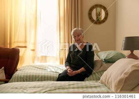 Elderly woman, portrait and sitting in bedroom with smile for retirement, wellness and confidence for fashion. Senior lady, happy and style inspiration in nursing home with ethical brand for clothes Elderly woman, portrait and sitting in bedroom with smile for retirement, wellness and confidence for fashion. Senior lady, happy and style inspiration in nursing home with ethical brand for clothes 116301461