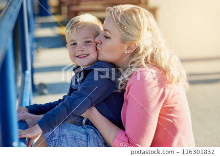 Mother, kiss and portrait of child for vacation, holiday and together with love outdoor by pier. Family, woman and boy on adventure in Los Angeles with relationship and smile on jetty in summer 116301832