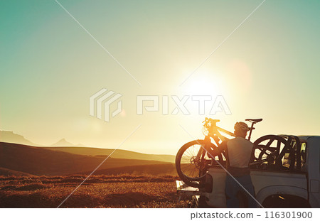 Sports, nature and man with bicycle in car for training, workout and exercise in countryside. Fitness, cycling and mountain bike in vehicle for outdoor adventure, travel journey and transportation Sports, nature and man with bicycle in car for training, workout and exercise in countryside. Fitness, cycling and mountain bike in vehicle for outdoor adventure, travel journey and transportation 116301900