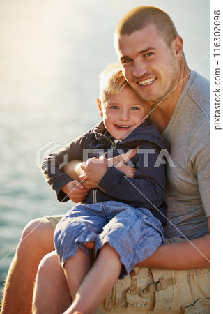 Father, son and portrait for adventure, holiday and together with love by water or pier. Family, man and child on vacation in California with happiness, relationship and summer at ocean on jetty 116302098