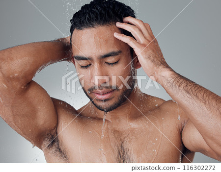 Shower, thinking and man in water with splash, topless and wellness on gray background. Skincare, relaxation and male person in bathroom with luxury, cleanliness and grooming or refreshment at home 116302272