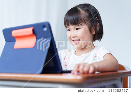 Elementary school students using tablets in class Elementary school students using tablets in class 116302417