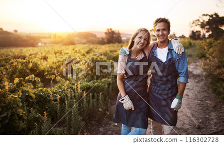 Love, hug and smile with couple on vineyard for agriculture, growth and wine. Teamwork, bonding and portrait with man and woman in grape field of countryside for farm, sustainability and environment 116302728