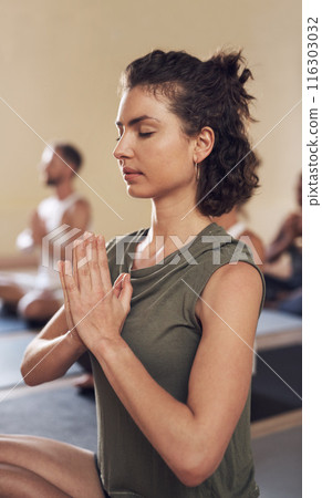 Woman, meditation and namaste in yoga class, breathe and exercise together for peace in studio. Female person, holistic and coach training a group of people, spiritual awareness and yogi for zen Woman, meditation and namaste in yoga class, breathe and exercise together for peace in studio. Female person, holistic and coach training a group of people, spiritual awareness and yogi for zen 116303032