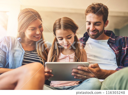 Happy, tablet and family hug on sofa with child, elearning and education for development. Home, girl and browsing on touchscreen for digital e book, learning online and website for school activity Happy, tablet and family hug on sofa with child, elearning and education for development. Home, girl and browsing on touchscreen for digital e book, learning online and website for school activity 116303248