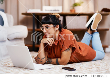 Lounge floor, internet and woman with laptop for social media post and news app for information. Computer, online video and designer girl on home carpet with research for art blog or tattoo business Lounge floor, internet and woman with laptop for social media post and news app for information. Computer, online video and designer girl on home carpet with research for art blog or tattoo business 116303392