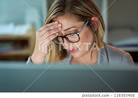 Frustrated woman, headache and night with stress in financial crisis, anxiety or burnout at office. Female person or business employee with migraine in depression, debt or working late for deadline 116303408