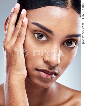 Portrait, woman and thinking in studio for skincare, eyebrow and beauty in morning. Girl, model and face for luxury or glow and idea with hand, cosmetics and pride for grooming by grey background 116303488