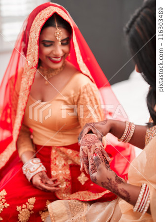 Indian bride, bridesmaid and ring for marriage, celebration and love for wedding. Woman, henna and home culture with traditional mehendi, sari and hindu bridal jewelry with support and help dressing Indian bride, bridesmaid and ring for marriage, celebration and love for wedding. Woman, henna and home culture with traditional mehendi, sari and hindu bridal jewelry with support and help dressing 116303489