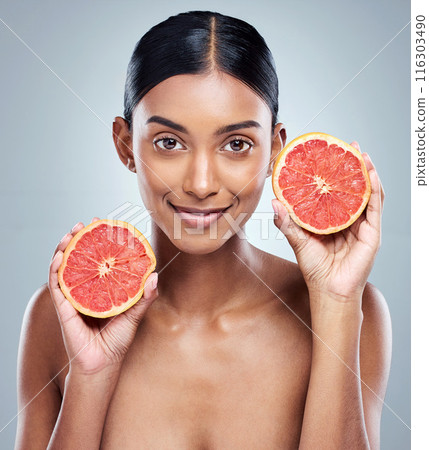 Skincare, grapefruit and happy woman with portrait in studio for facial treatment, natural or skin glow on white background. Wellness, fruit and model for vitamin C, dermatology or organic cosmetics Skincare, grapefruit and happy woman with portrait in studio for facial treatment, natural or skin glow on white background. Wellness, fruit and model for vitamin C, dermatology or organic cosmetics 116303490