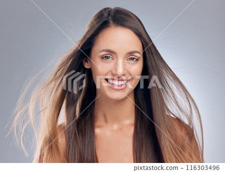 Woman, portrait and hair care in studio with wind, treatment and results for cosmetics. Female person, beauty and hairstyle by white background with glow, luxury and shampoo for shine and keratin Woman, portrait and hair care in studio with wind, treatment and results for cosmetics. Female person, beauty and hairstyle by white background with glow, luxury and shampoo for shine and keratin 116303496