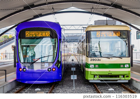 Hiroshima Electric Railway 5100 and 3900 series trains parked at Miyajimaguchi Station Hiroshima Electric Railway 5100 and 3900 series trains parked at Miyajimaguchi Station 116303519