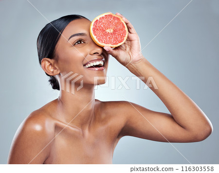 Indian woman, grapefruit and skincare for organic beauty, hand and fruit on white background. Citrus, food and vitamin c with acid for balanced skin or body care, studio and female person for detox Indian woman, grapefruit and skincare for organic beauty, hand and fruit on white background. Citrus, food and vitamin c with acid for balanced skin or body care, studio and female person for detox 116303558
