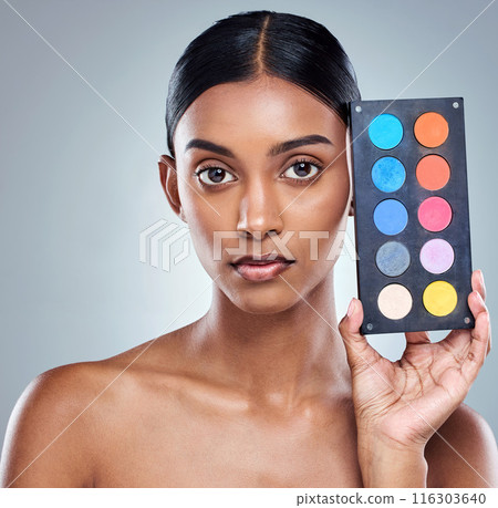 Beauty, makeup palette and woman with portrait in studio for cosmetics, powder or foundation on gray background. Face, skincare and model with cosmetology product, facial glow and eyeshadow 116303640