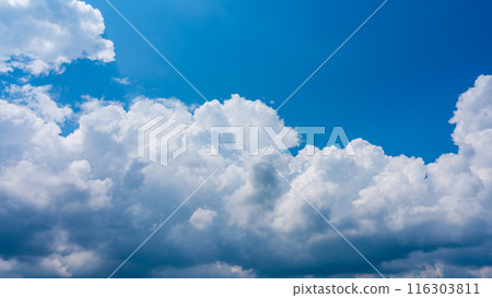 White clouds appearing in the blue summer sky White clouds appearing in the blue summer sky 116303811