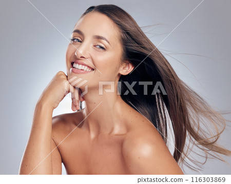 Woman, portrait and haircare in studio with wind, treatment and idea for cosmetics. Model girl, thinking and happy for hairstyle by white background with pride, luxury and shampoo for shine and glow 116303869
