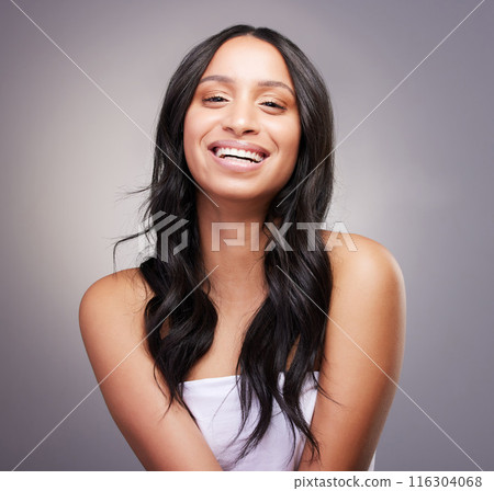 Portrait, woman and happy in studio for hair care, beauty and luxury salon treatment on grey background. Girl, face and confidence with healthy texture, hairstyle and growth for wellness with smile 116304068