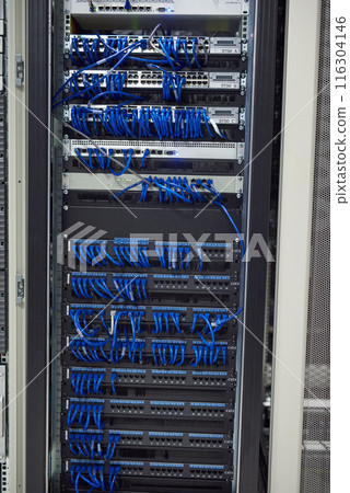 Data center, cables and hardware in server room for information technology, configuration or software update. Empty, hub and wiring for security patch, system recovery or optimize performance 116304146