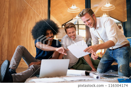 Business people, laptop and meeting with documents in discussion for teamwork, idea and review. Interior design, employee and men with paper in office for project plan, brainstorming and feedback 116304174