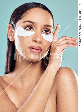 Woman, hands and eye patch for beauty and skincare, hydration and refresh on blue background. Mock up, dermatology and facial treatment for collagen, thinking and detox for female person in studio 116304304