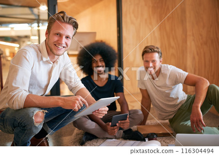 Tech, smile and portrait of creative people in office with meeting for programming, plan and research. Engineering, team and men with multimedia on floor for software development, website and review Tech, smile and portrait of creative people in office with meeting for programming, plan and research. Engineering, team and men with multimedia on floor for software development, website and review 116304494