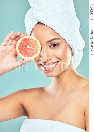 Portrait, skincare and woman with grapefruit for beauty, vegan diet and natural facial glow in studio. citrus food, dermatology and model girl with skin health for vitamin c detox by blue background Portrait, skincare and woman with grapefruit for beauty, vegan diet and natural facial glow in studio. citrus food, dermatology and model girl with skin health for vitamin c detox by blue background 116304546