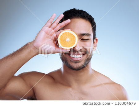 Skincare, orange and man model with smile on studio background for natural cosmetics, grooming or citrus treatment. Body, hand and Asian person with eyes closed for vitamin c, wellness or dermatology Skincare, orange and man model with smile on studio background for natural cosmetics, grooming or citrus treatment. Body, hand and Asian person with eyes closed for vitamin c, wellness or dermatology 116304679