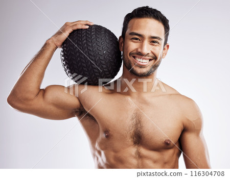 Portrait, fitness and happy man with medicine ball in studio for body care, wellness and health for muscles. Male person, bodybuilder and workout or training for weight loss by white background 116304708