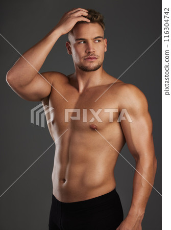 Thinking, body and fitness man in studio for wellness, training and muscle growth progress on black background. Sports, six pack and athlete with health, exercise and bodybuilding workout results Thinking, body and fitness man in studio for wellness, training and muscle growth progress on black background. Sports, six pack and athlete with health, exercise and bodybuilding workout results 116304742