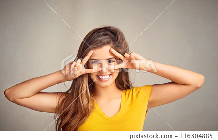 Portrait, hands and woman with peace sign in studio with smile for happiness, good mood or face expression on white background. V, emoji and female model for gesture, positivity or confidence 116304885
