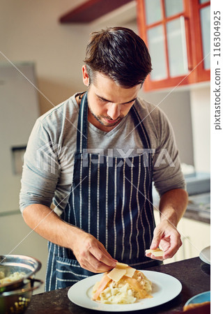 Man, chef and cooking food in home for dinner or eating on kitchen counter with pasta and cheese. Male person, dish and meal prep for lunch, brunch and wellness with recipe for dining in house Man, chef and cooking food in home for dinner or eating on kitchen counter with pasta and cheese. Male person, dish and meal prep for lunch, brunch and wellness with recipe for dining in house 116304925