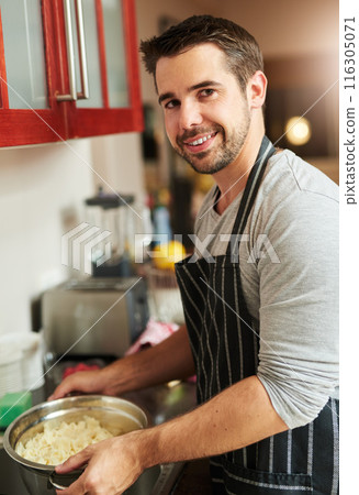 Man, pot and cooking food in home for dinner or eating on kitchen counter with portrait and rice. Male person, smile and meal prep for supper, wellness and nutrition with recipe for dining in house 116305071