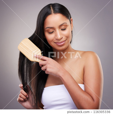 Haircare, brush and woman in studio with eyes closed for grooming, scalp treatment or keratin on gray background. Hairstyle, beauty and hands of model for satisfaction, cosmetics or collagen shine 116305336