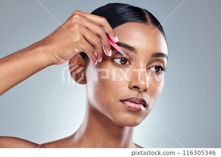 Tweezers, woman and eyebrow in studio for skincare, epilation and beauty in morning. Girl, model and face for hair removal and transformation with tools, cosmetics and grooming by grey background Tweezers, woman and eyebrow in studio for skincare, epilation and beauty in morning. Girl, model and face for hair removal and transformation with tools, cosmetics and grooming by grey background 116305346