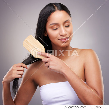 Hair care, brush and woman in studio with eyes closed for grooming, scalp treatment or keratin on gray background. Hairstyle, beauty and hands of model for satisfaction, cosmetics or collagen shine Hair care, brush and woman in studio with eyes closed for grooming, scalp treatment or keratin on gray background. Hairstyle, beauty and hands of model for satisfaction, cosmetics or collagen shine 116305355