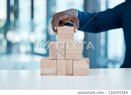 Corporate, building blocks and hand in office for growth, strategy and development in city. Wood puzzle, black businessman and startup in workplace for investment, future and solution in company Corporate, building blocks and hand in office for growth, strategy and development in city. Wood puzzle, black businessman and startup in workplace for investment, future and solution in company 116305364
