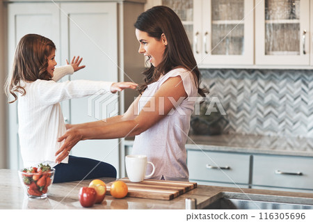 Counter, mother and hug with girl, kitchen or bonding in weekend, house and kid with smile. Home, child and mom with daughter, embrace and together in morning, peace or happiness in apartment 116305696