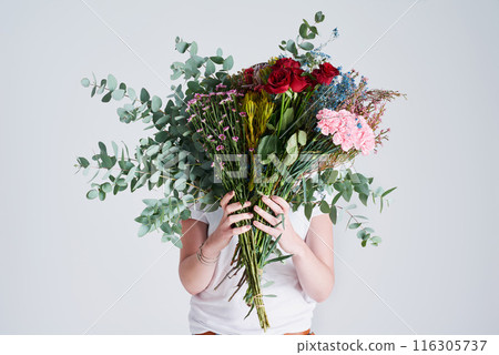 Woman, hands and rose with bouquet of flowers for floral, anniversary or gift on a white studio background. Female person or model with natural plant, leaves or stem for romance, present or love 116305737